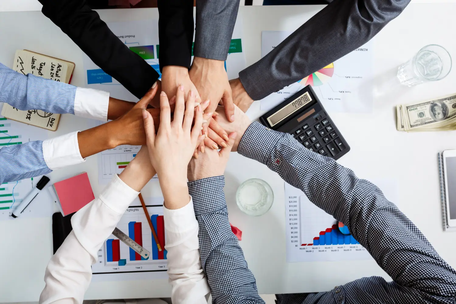 businessmen-hands-white-table-with-documents-drafts